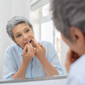 woman flossing