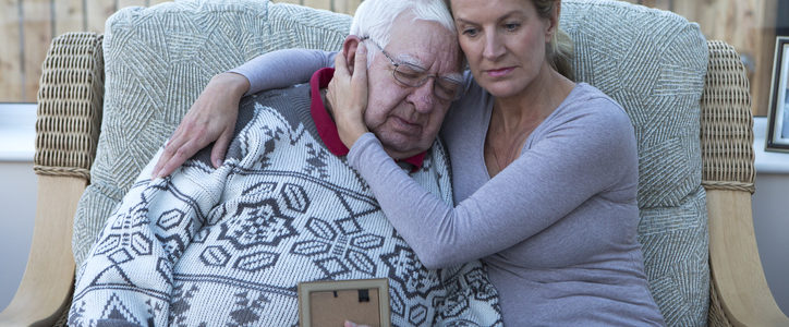 woman and senior man hugging