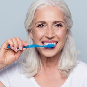 Woman brushing teeth